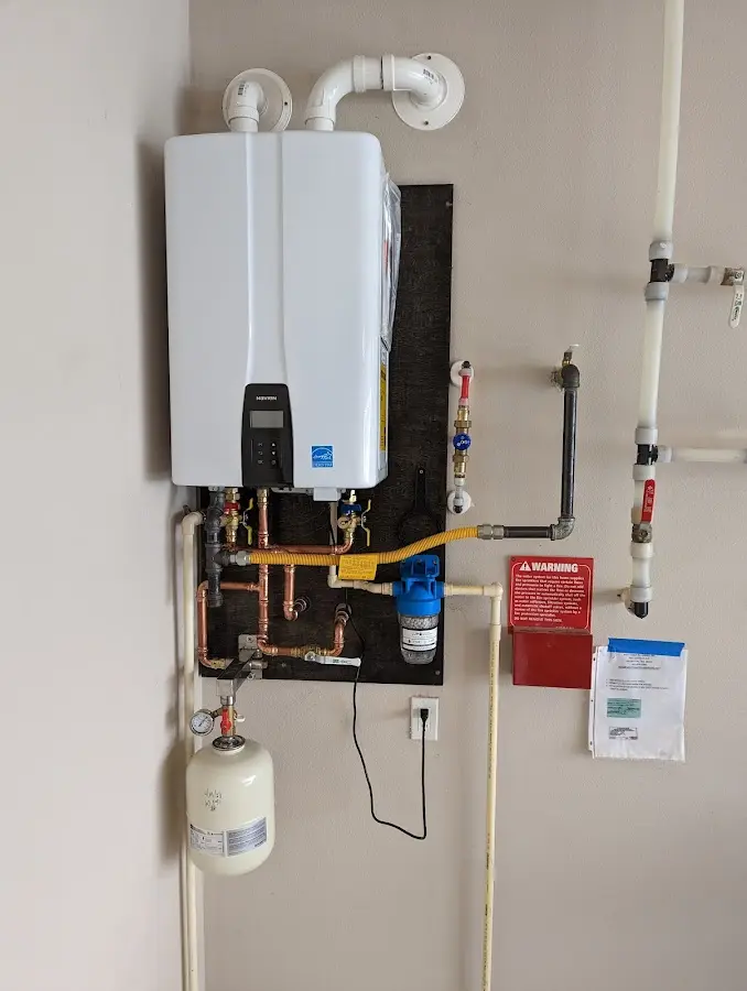 Professional plumber installing copper piping in a St. Martinville home